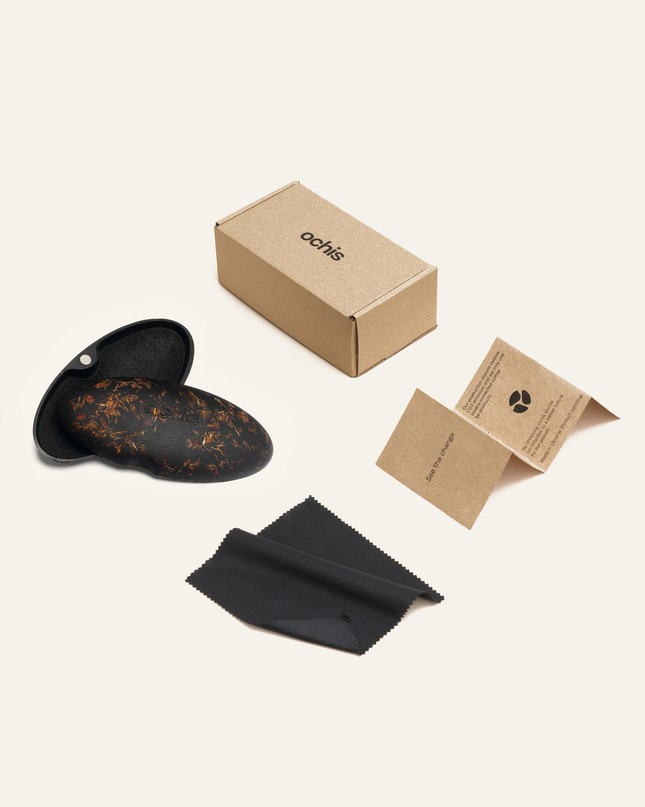 Laden Sie das Bild in den Galerie-Viewer, Ochis sunglasses set including eco-conscious packaging, a protective case, and a microfiber cleaning cloth