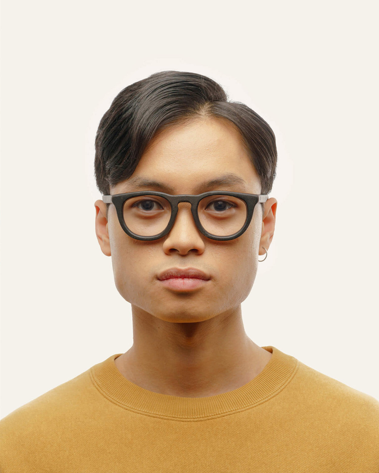 Load image into Gallery viewer, Man wearing Anderson Black optical frames, highlighting their unisex appeal and elegant simplicity
