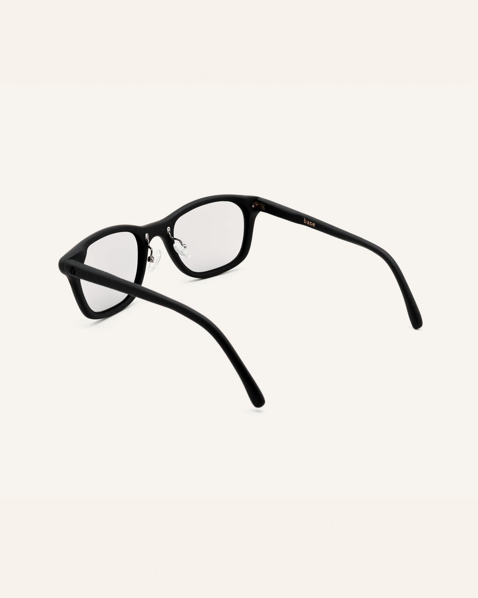 Detailed view of prescription glasses with polished black frames, crafted for fashion-forward individuals.