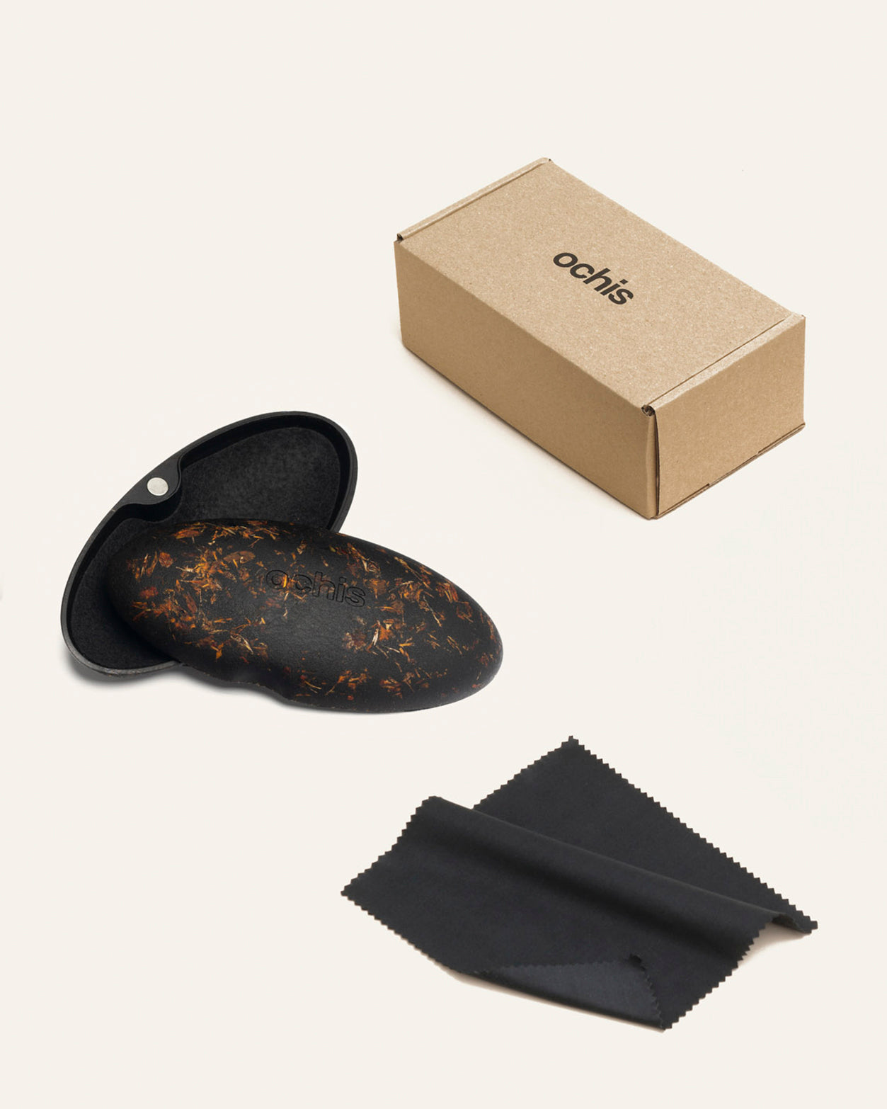 Stylish glasses case with marigold accents, paired with eco-friendly packaging for a complete sustainable set