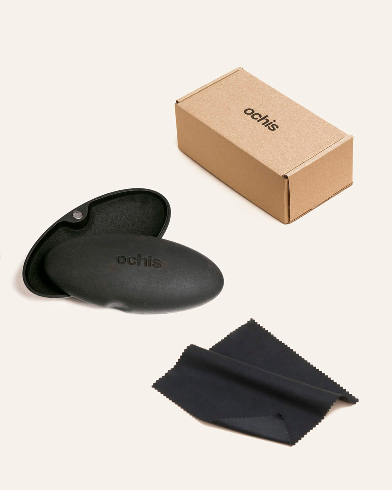 Black sustainable eyewear case made from coffee-based materials, displayed with eco-friendly packaging on a neutral background