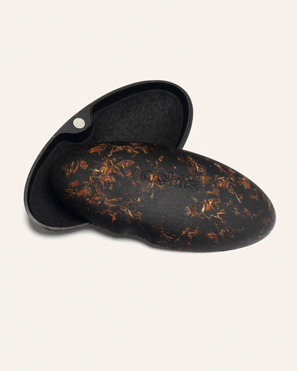 Open eco-friendly case made from coffee-based materials, adorned with vibrant marigold petals for a natural and artistic touch