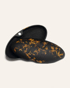 Open coffee-based case featuring delicate sunflower petals, blending eco-friendly design with a natural artistic flair