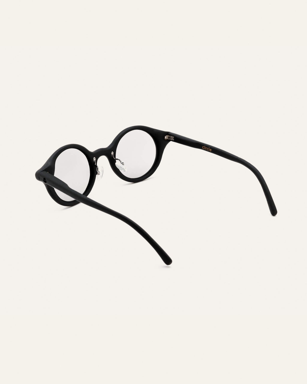 Load image into Gallery viewer, Close-up of black round optical frames, showcasing their polished texture and eco-conscious materials
