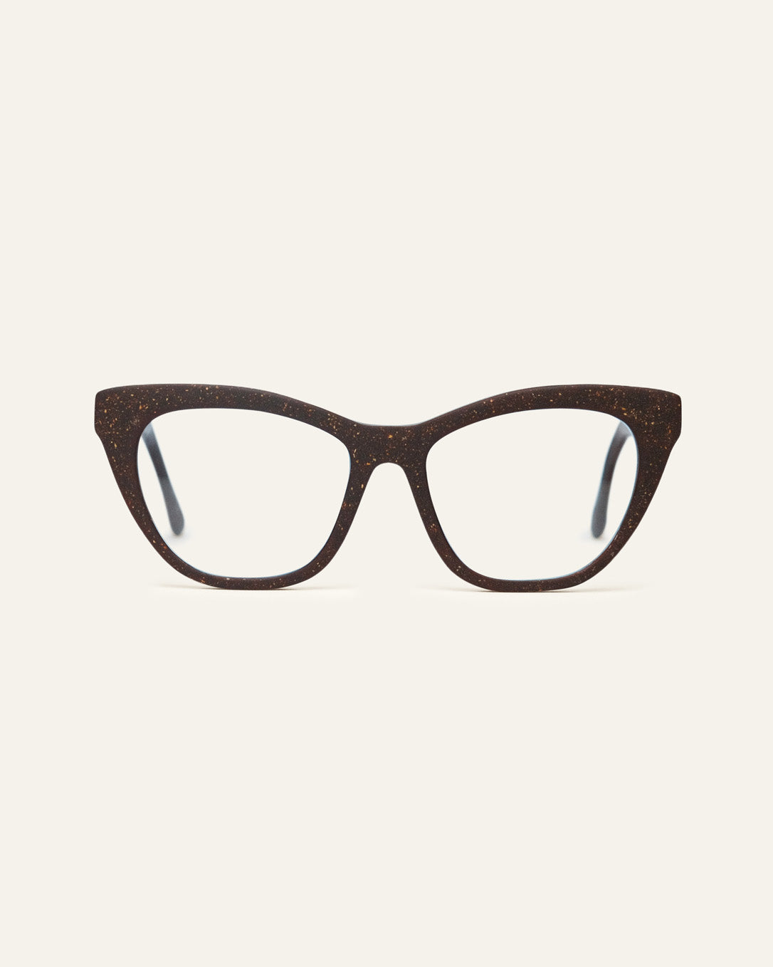 A pair of cat-eye eyeglasses with a dark brown speckled frame and clear lenses, shown against a solid off-white background.