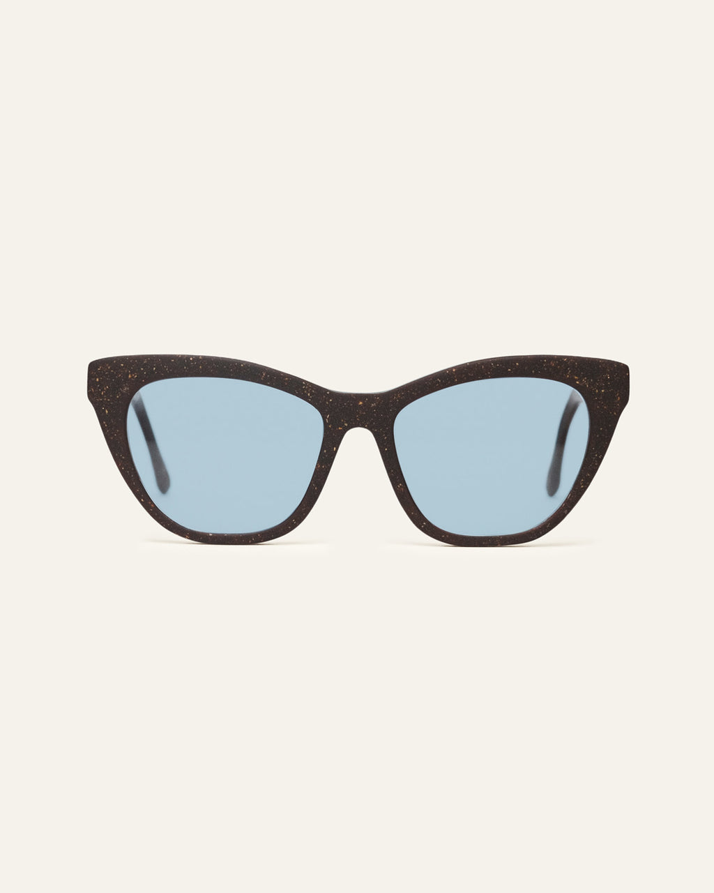 Front view of Define Flow cat-eye sunglasses with blue lenses and a brown coffee-based frame with visible walnut shell particles