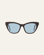 Front view of Define Flow cat-eye sunglasses with blue lenses and a brown coffee-based frame with visible walnut shell particles
