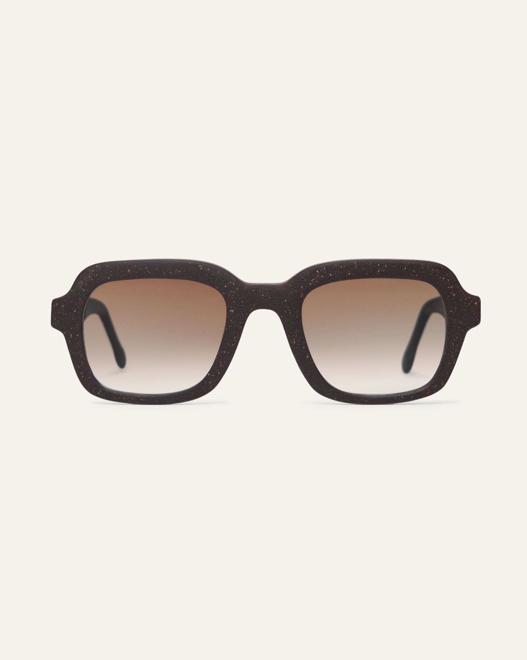 Front view of Lead Warm rectangular sunglasses with brown lenses and a brown coffee-based frame with visible walnut shell particles