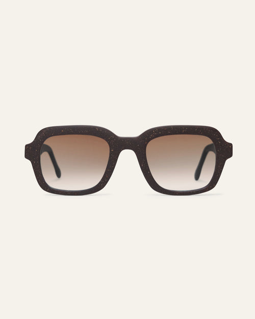 Front view of Lead Warm rectangular sunglasses with brown lenses and a brown coffee-based frame with visible walnut shell particles