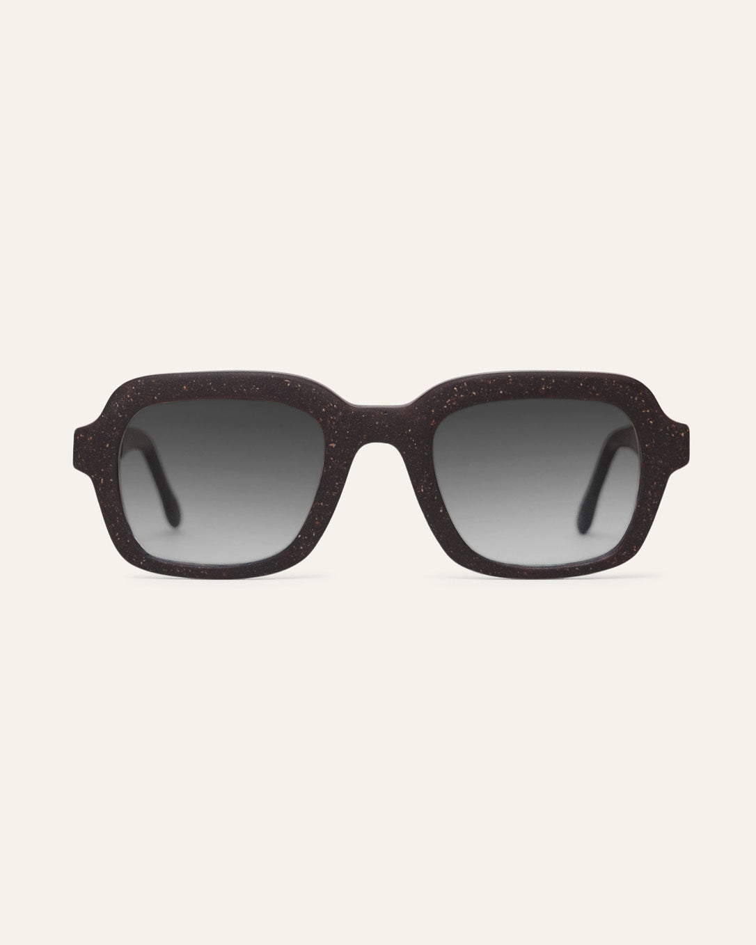 Front view of Lead Quiet rectangular sunglasses with gray lenses and a brown coffee-based frame with visible walnut shell particles