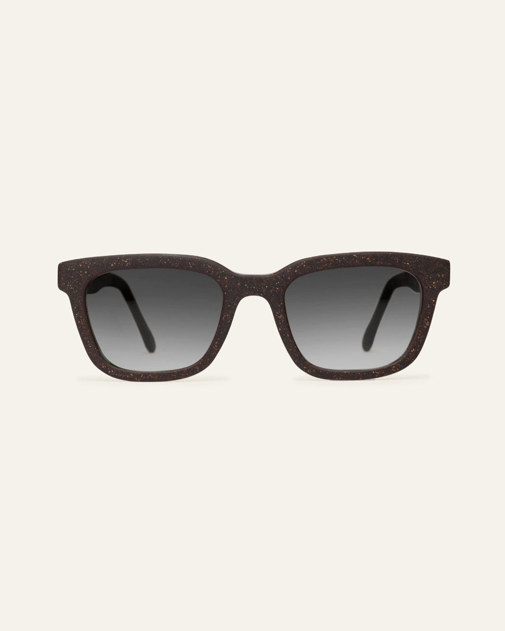 Front view of Move Quite rectangular sunglasses with gray lenses and a brown coffee-based frame with visible walnut shell particles