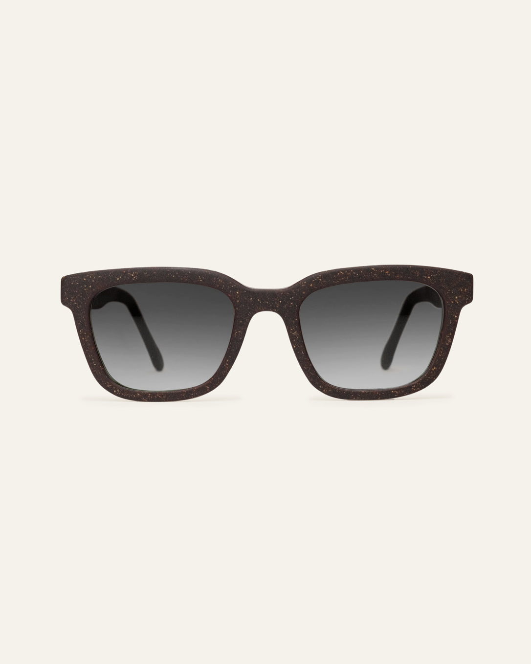 Front view of Move Quite rectangular sunglasses with gray lenses and a brown coffee-based frame with visible walnut shell particles