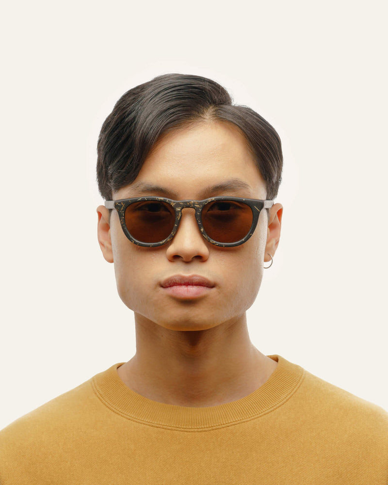 Stylish sunglasses with brown lenses, crafted from coffee-based material with flax detailing.