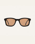 Dandy sunglasses with warm brown lenses on a white background, featuring a black coffee-based frame