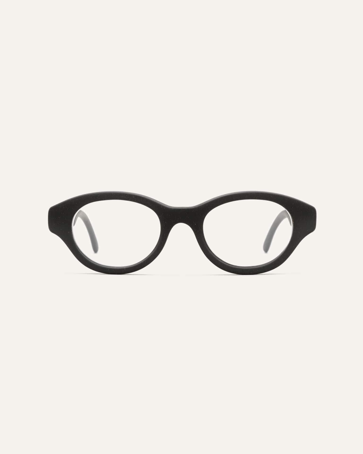 Black eco-friendly optical frame made from coffee-based materials, featuring a sleek oval design for corrective lenses