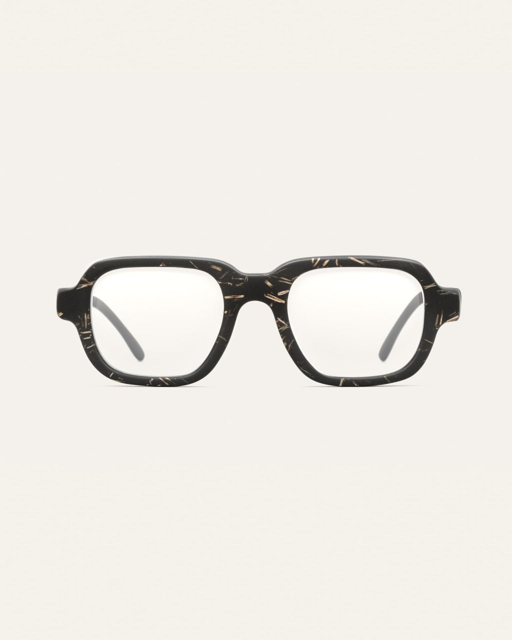 Black coffee-based optical frame with flax textures on a neutral background.