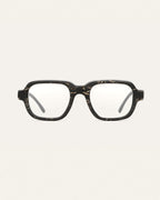 Black coffee-based optical frame with flax textures on a neutral background.