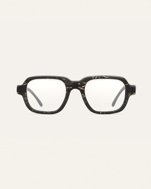Black coffee-based optical frame with flax textures on a neutral background.