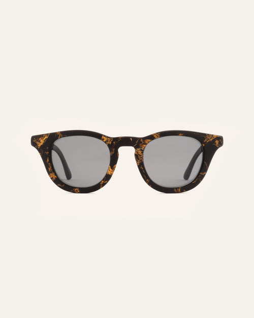 Sunglasses with gray lenses, crafted from coffee-based frames and accented with vibrant sunflower petals
