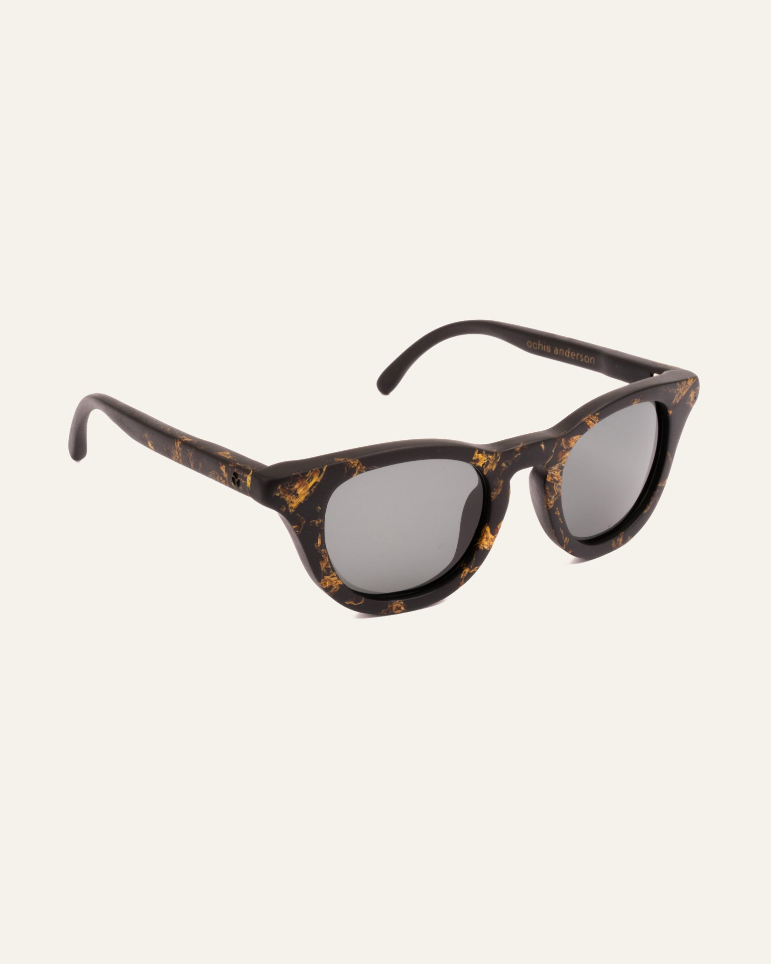 Side view of modern sunglasses with gray lenses, blending natural materials with minimalist design.