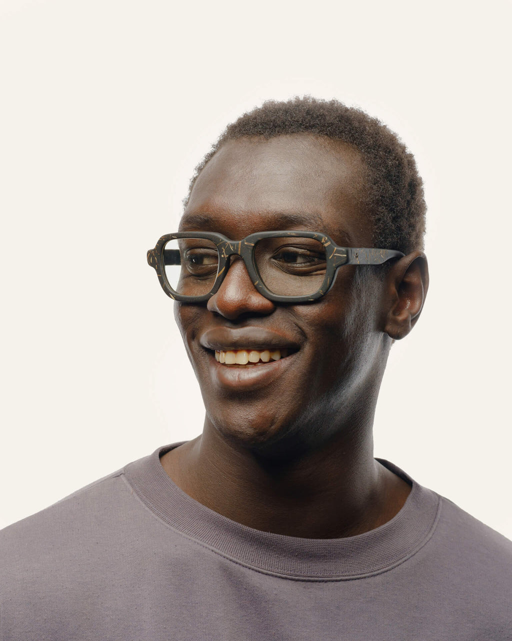 Smiling man wearing eco-friendly black optical glasses