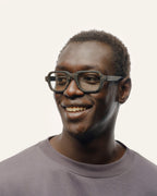 Smiling man wearing eco-friendly black optical glasses