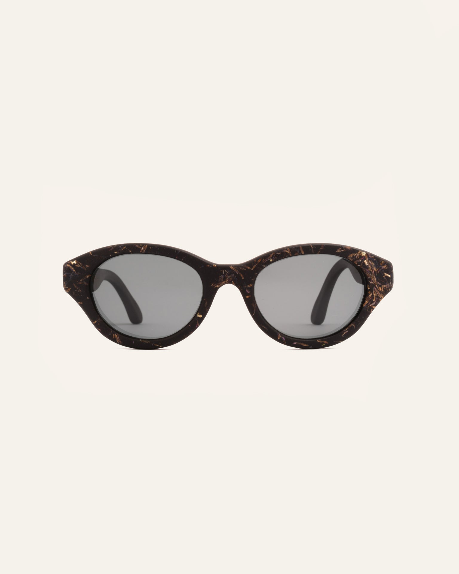 Biobased eco-friendly sunglasses with gray polarized lenses, featuring a coffee frame accented with cornflower petals