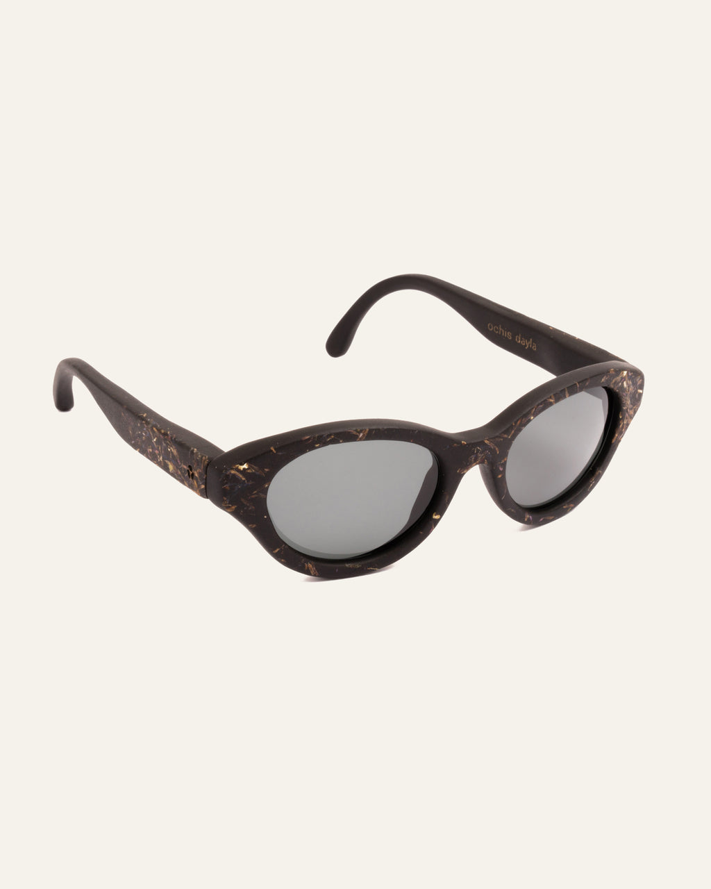 Side angle of lightweight sunglasses made from coffee and adorned with unique cornflower accents