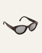 Side angle of lightweight sunglasses made from coffee and adorned with unique cornflower accents