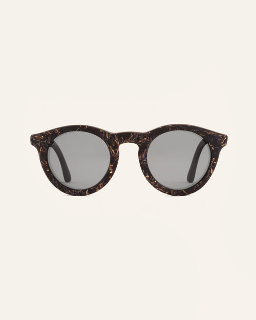 Front view of Kole Krasa sunglasses with gray polarized lenses and coffee-based frames adorned with light-blue cornflower petals
