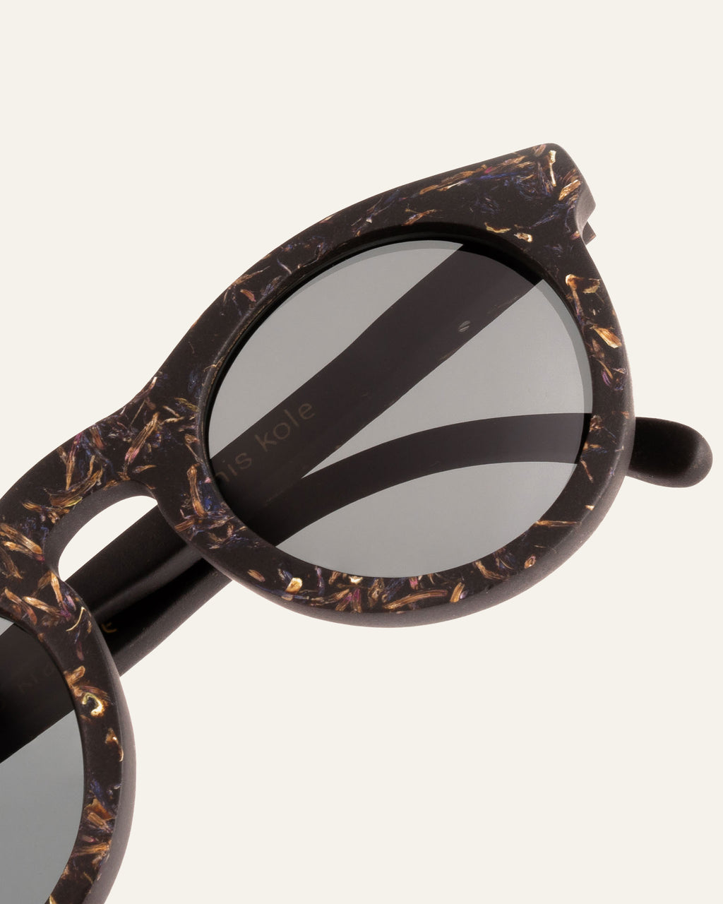 Close-up of Kole Krasa frames, highlighting the unique cornflower petal design and coffee-based eco materials