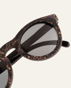 Close-up of Kole Krasa frames, highlighting the unique cornflower petal design and coffee-based eco materials