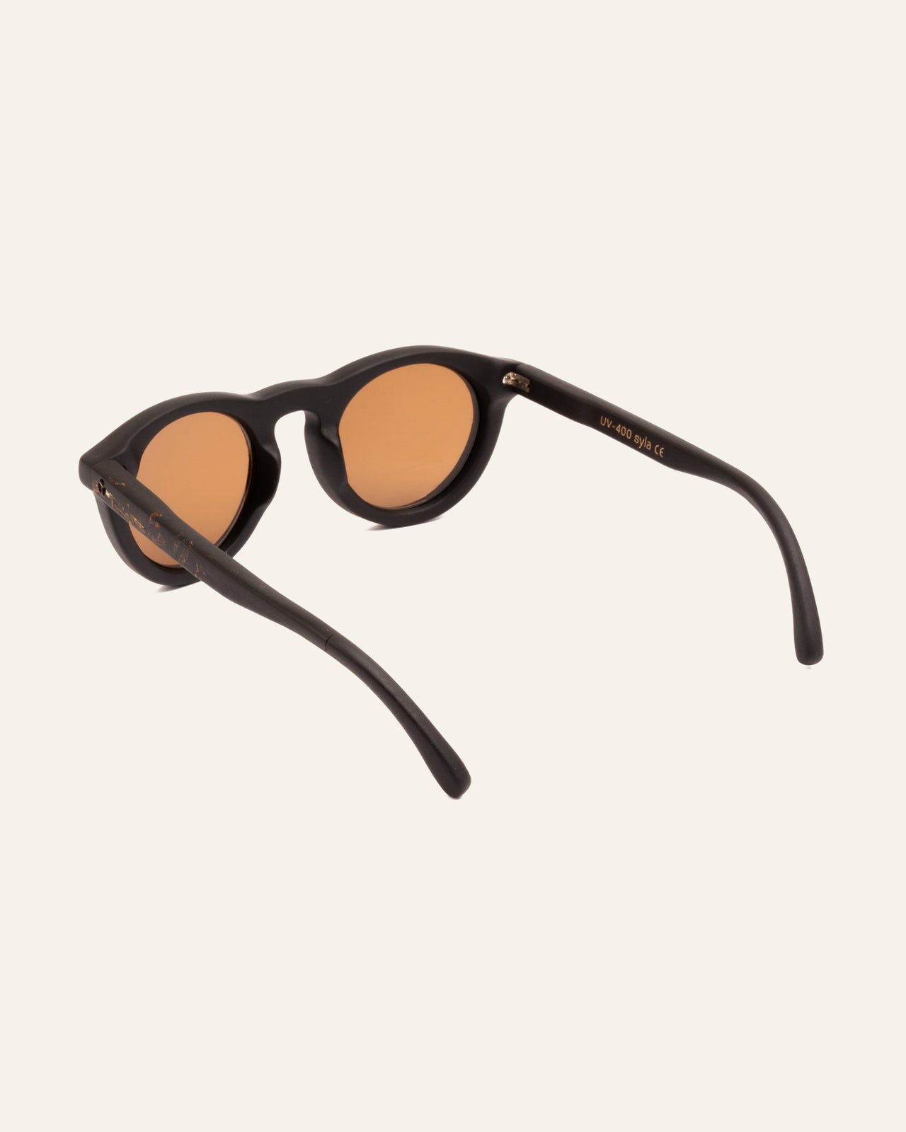 Load image into Gallery viewer, Angled perspective of Kole Syla sunglasses adorned with natural marigold petals, highlighting their elegant, eco-conscious design
