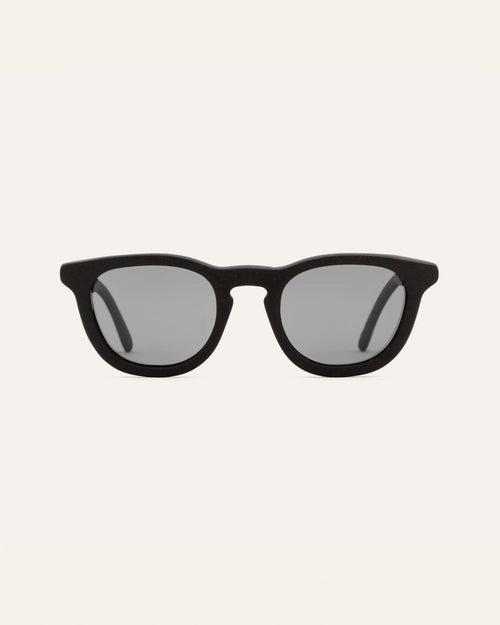 Anderson Black sunglasses on a white background, highlighting their minimalist and eco-friendly design