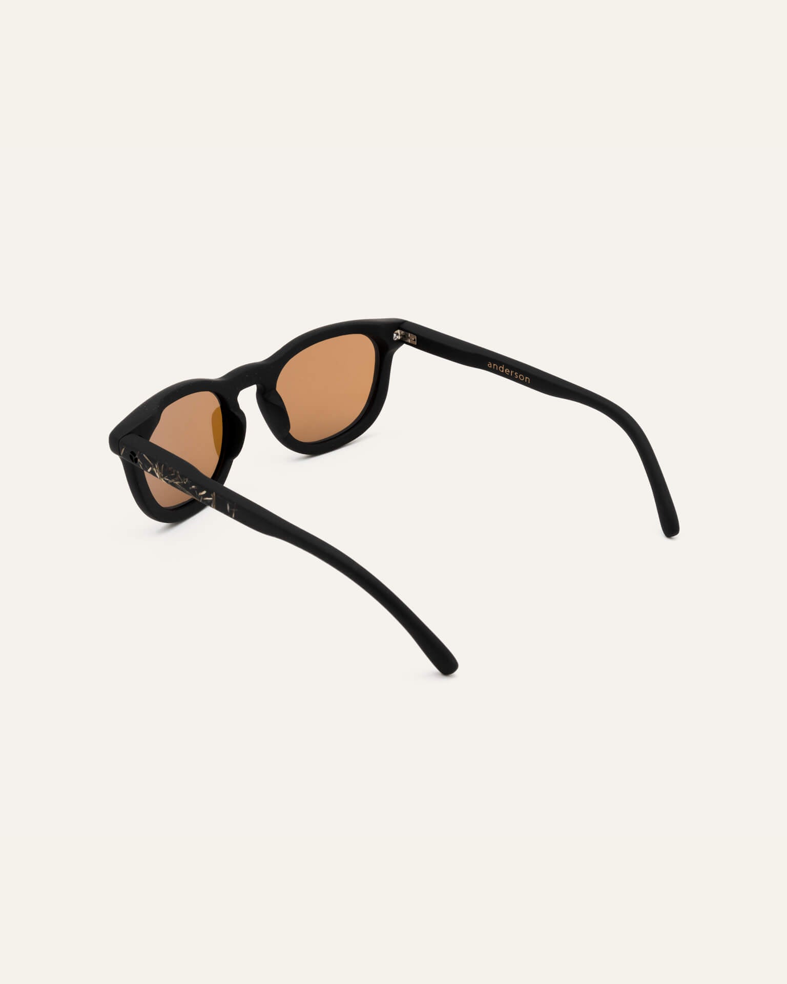 Angled view of modern sunglasses with brown lenses, perfect for sunny days.