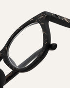 Close-up of natural-textured eyewear, showcasing its minimalist design and eco materials.