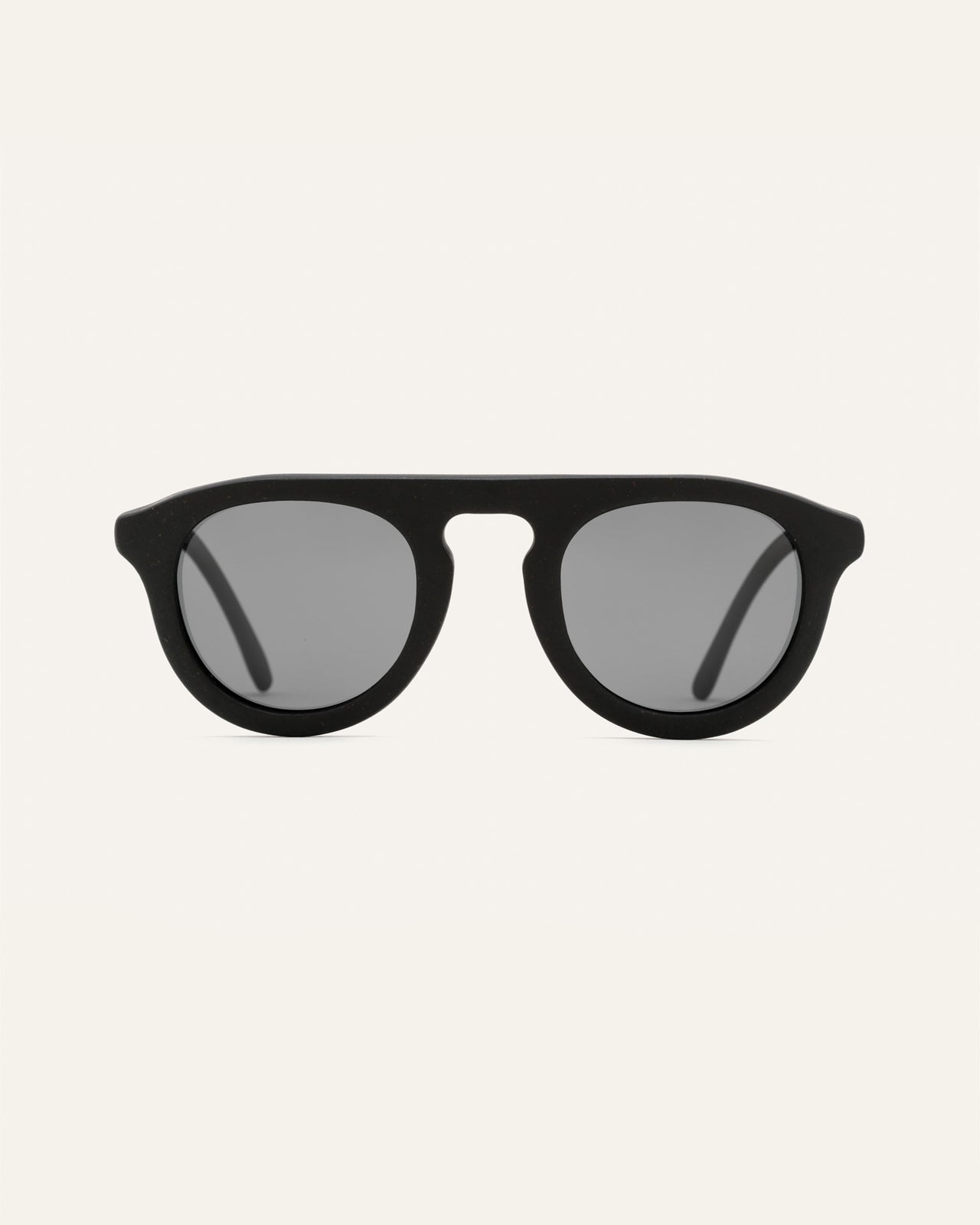 Load image into Gallery viewer, Minimalist black sunglasses with sleek gray lenses, crafted from coffee-based eco-friendly materials
