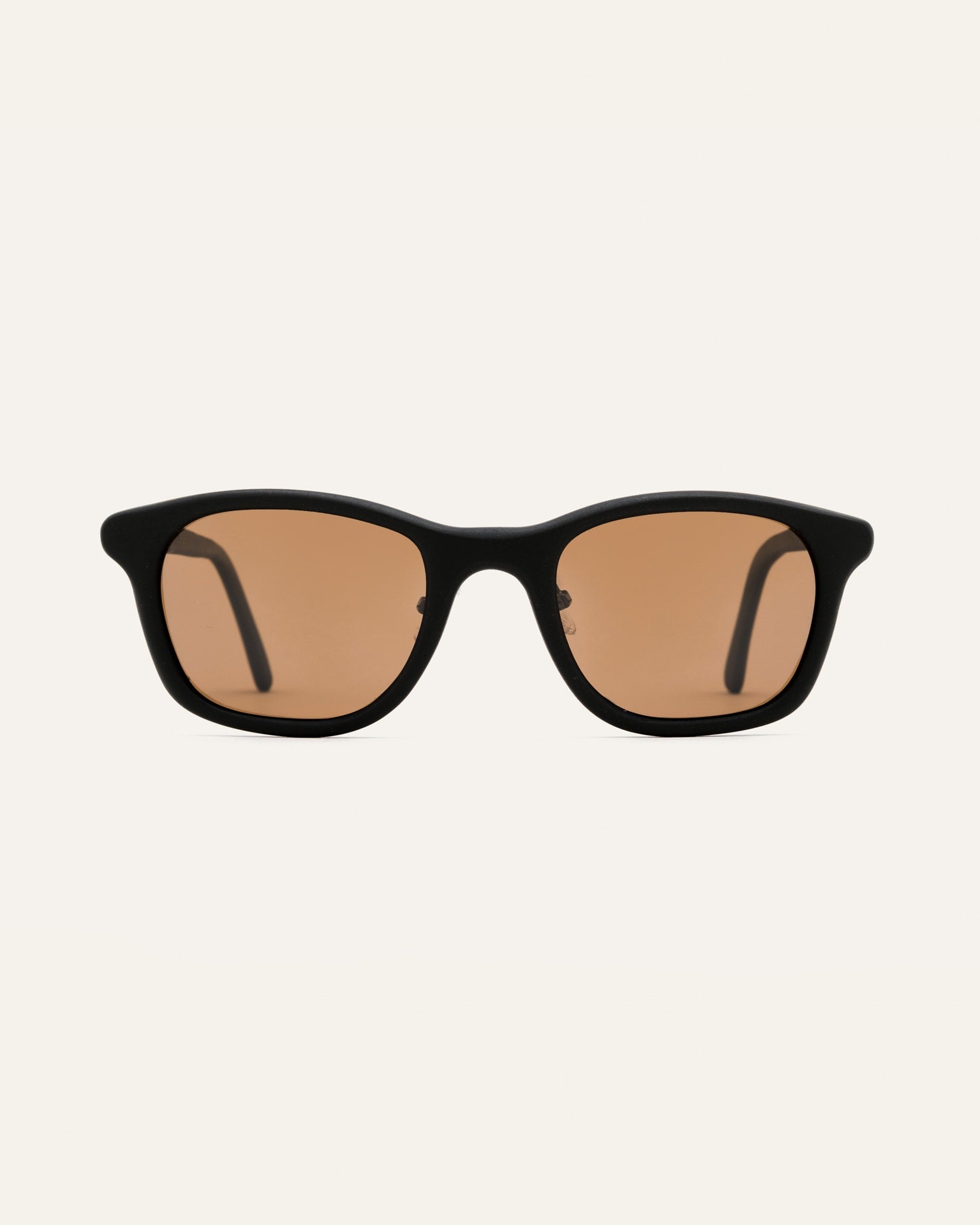 Classic black Base sunglasses with warm brown lenses, crafted for eco-conscious style.