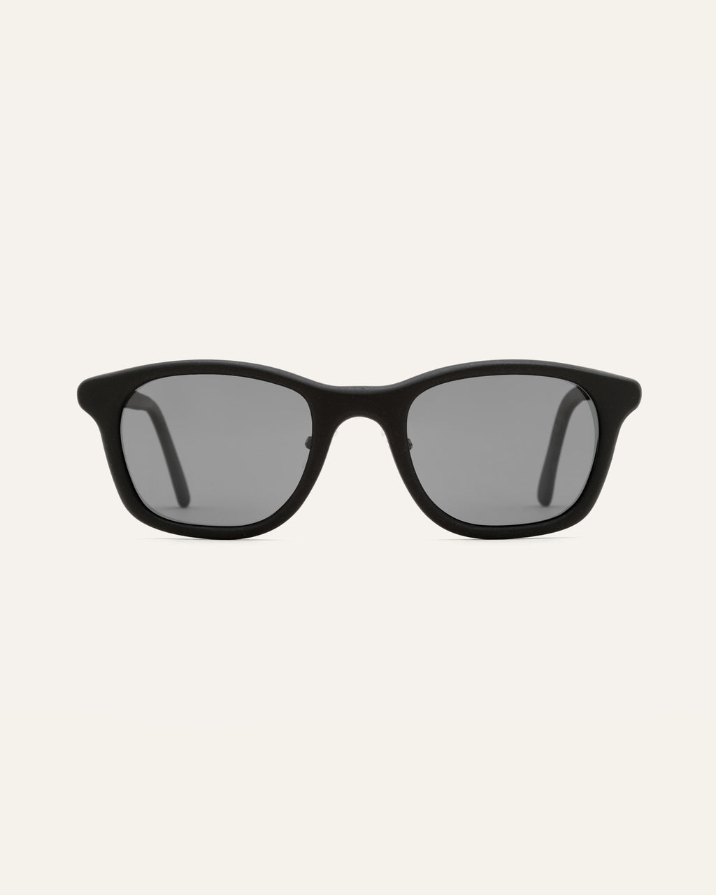 Black Base sunglasses with gray lenses, crafted for eco-conscious people in New York.