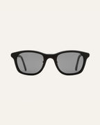 Black Base sunglasses with gray lenses, crafted for eco-conscious people in New York.