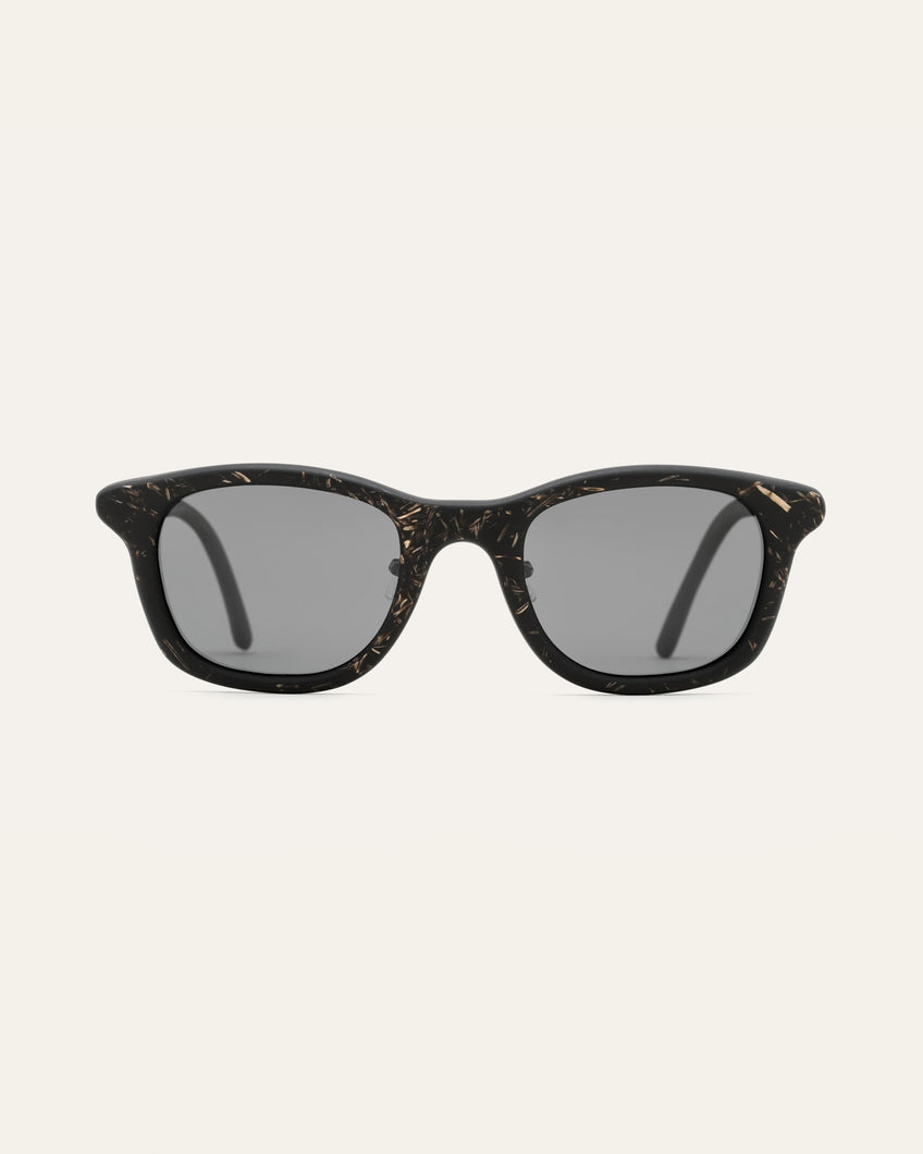 Stylish black Base sunglasses with flax detailing, featuring eco-friendly materials and sleek gray UV protected lenses.