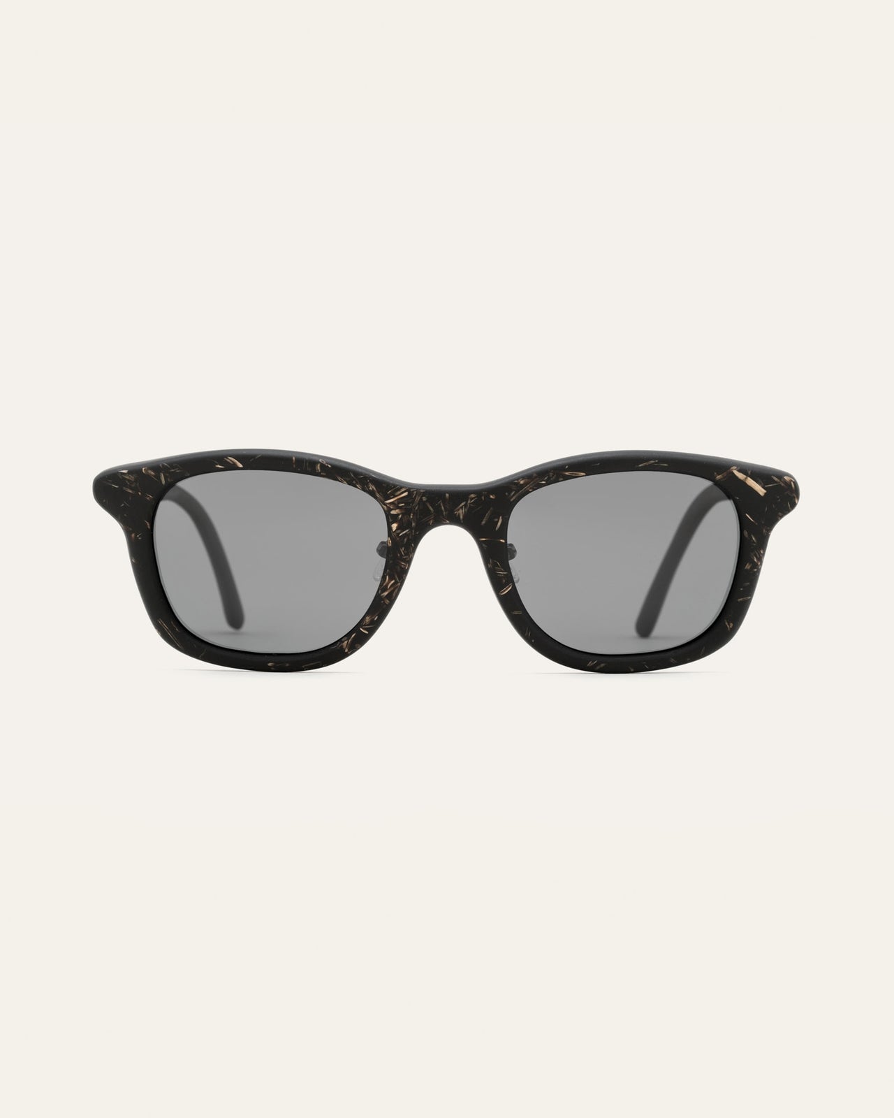 Load image into Gallery viewer, Stylish black Base sunglasses with flax detailing, featuring eco-friendly materials and sleek gray UV protected lenses.
