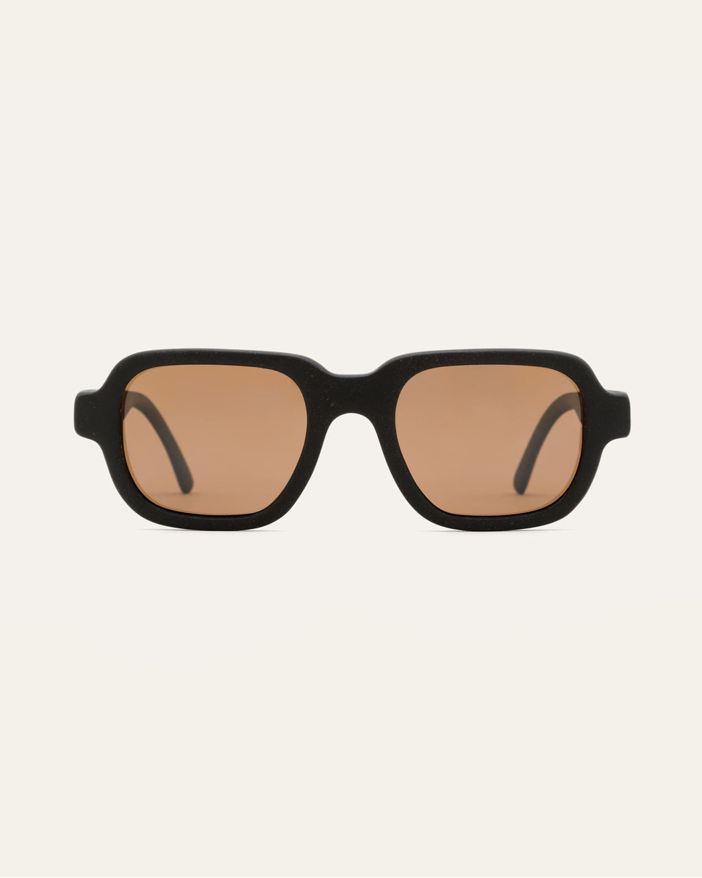 Ochis Brade sunglasses with warm brown lenses, crafted from coffee-based materials, displayed on a clean background.