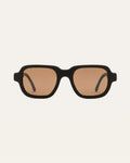 Ochis Brade sunglasses with warm brown lenses, crafted from coffee-based materials, displayed on a clean background.