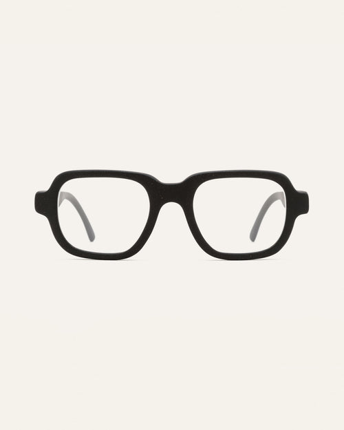 Black optical frames crafted from coffee-based materials, displayed on a neutral background.