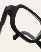 Close-up of black frames made from coffee grounds, highlighting the smooth finish and natural craftsmanship.