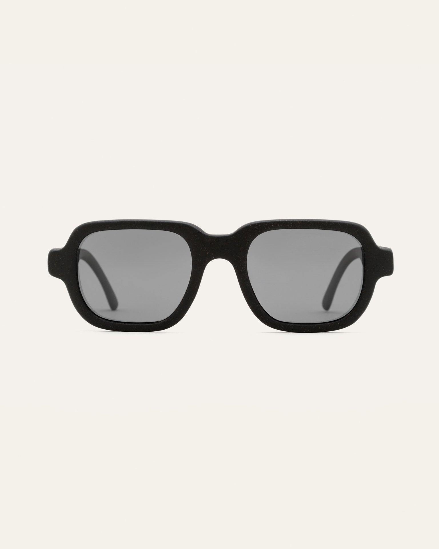 Ochis Brade coffee-based sunglasses with sleek gray lenses displayed against a neutral background