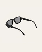 Ochis Brade sunglasses on display with a technical diagram showing precise frame dimensions.