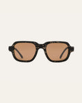 Sunglasses with black coffee-based frames and brown lenses on a white background