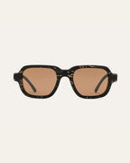Sunglasses with black coffee-based frames and brown lenses on a white background